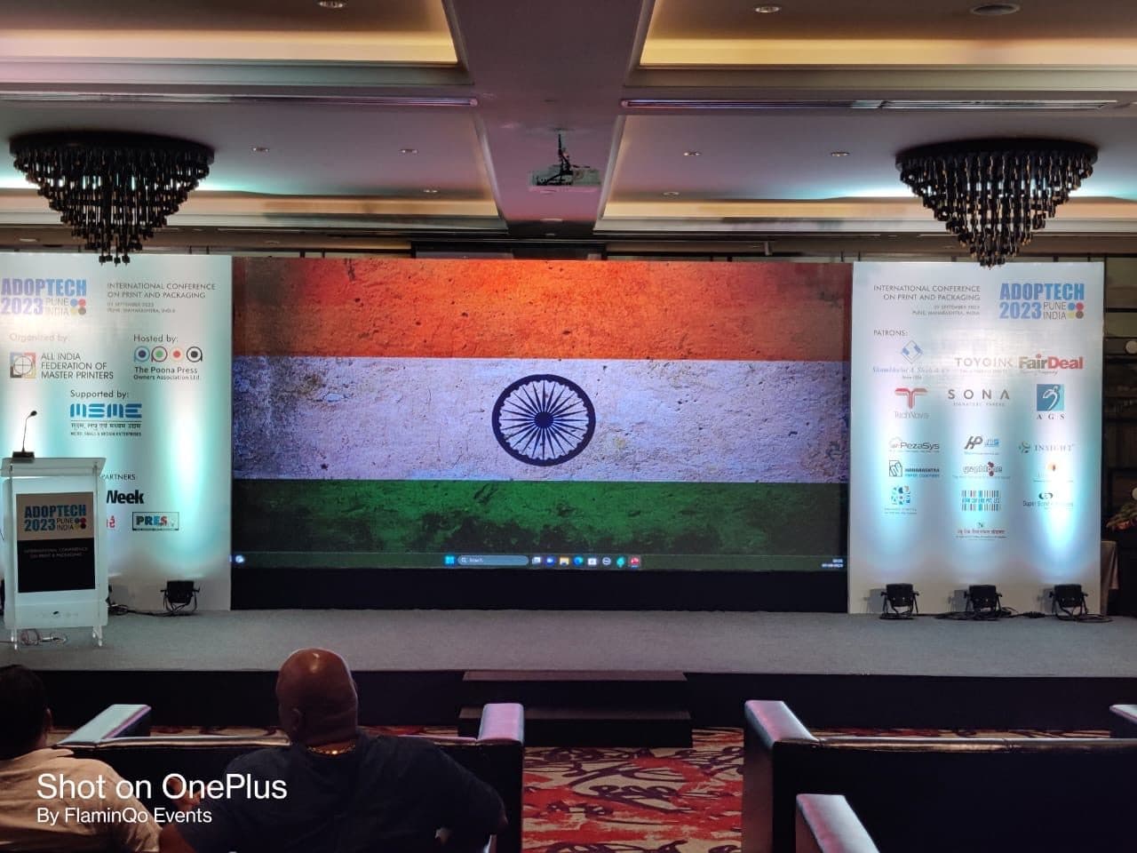 Awareness event stage with the Indian flag on a large LED display