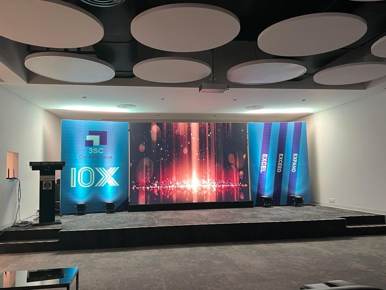 A corporate stage with a large LED wall